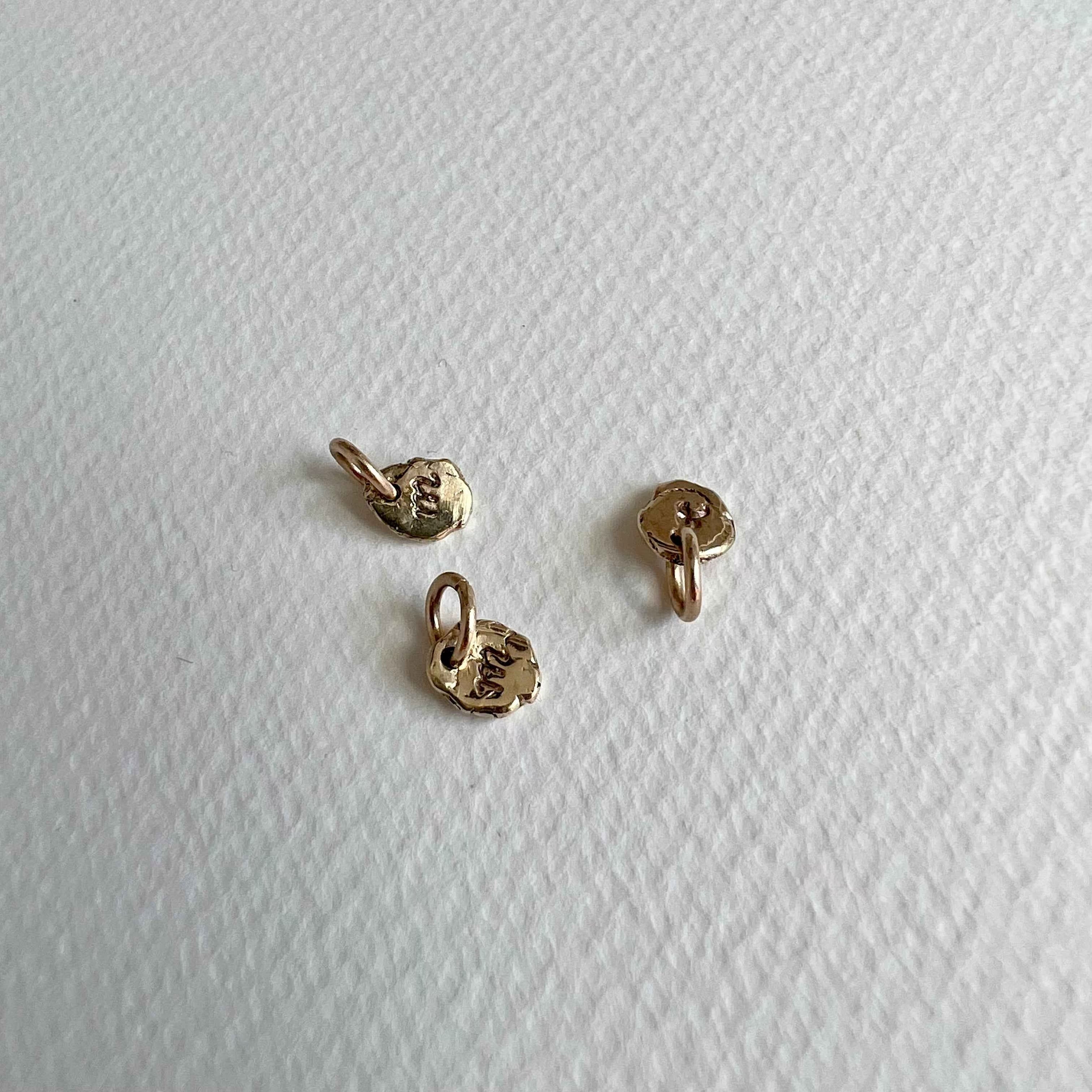 formed initial - solid gold