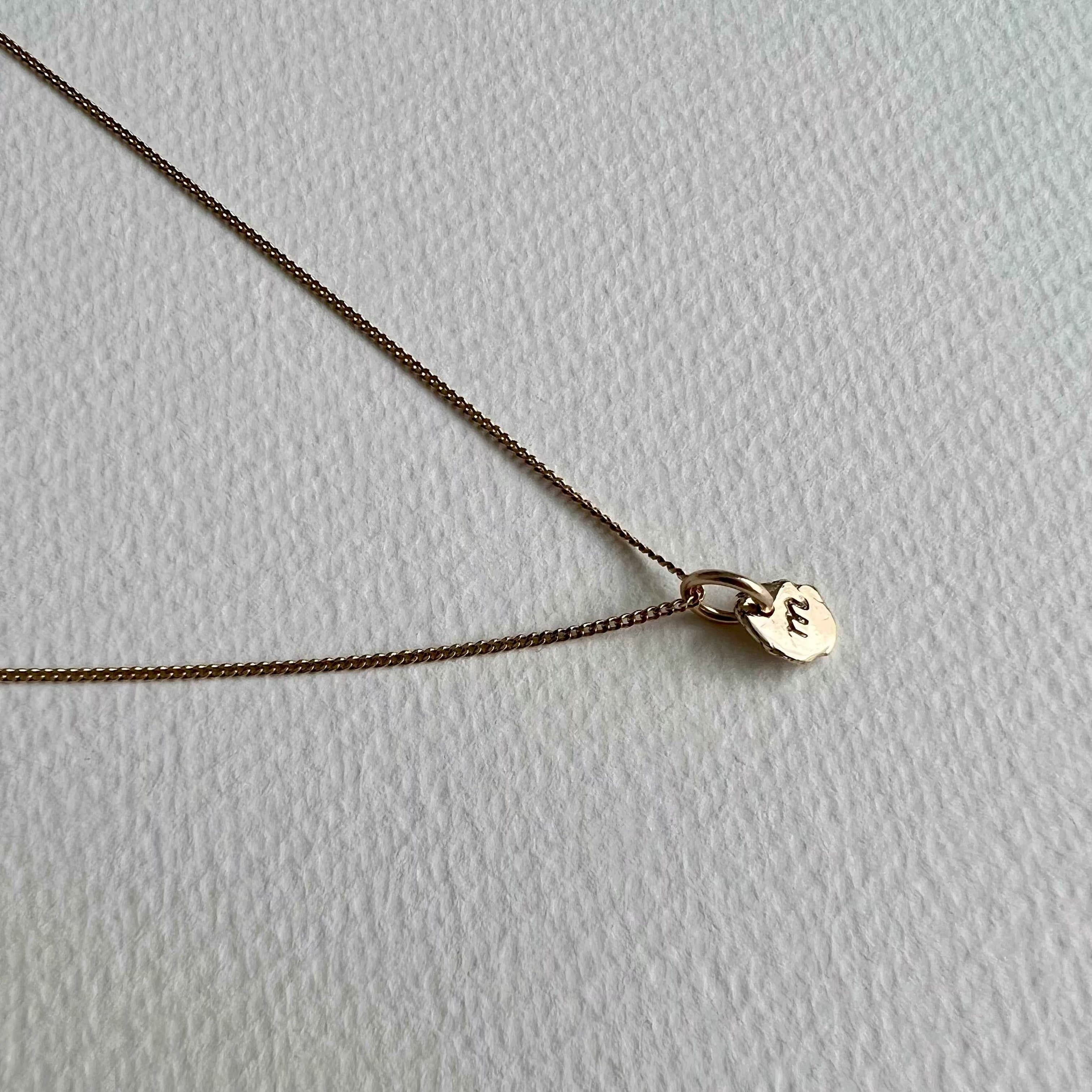formed initial - solid gold