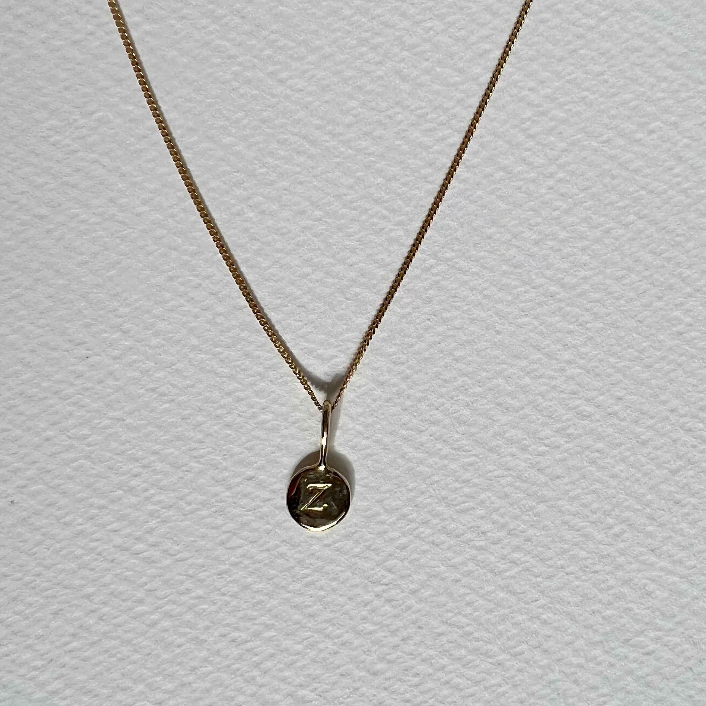 little initial - solid gold